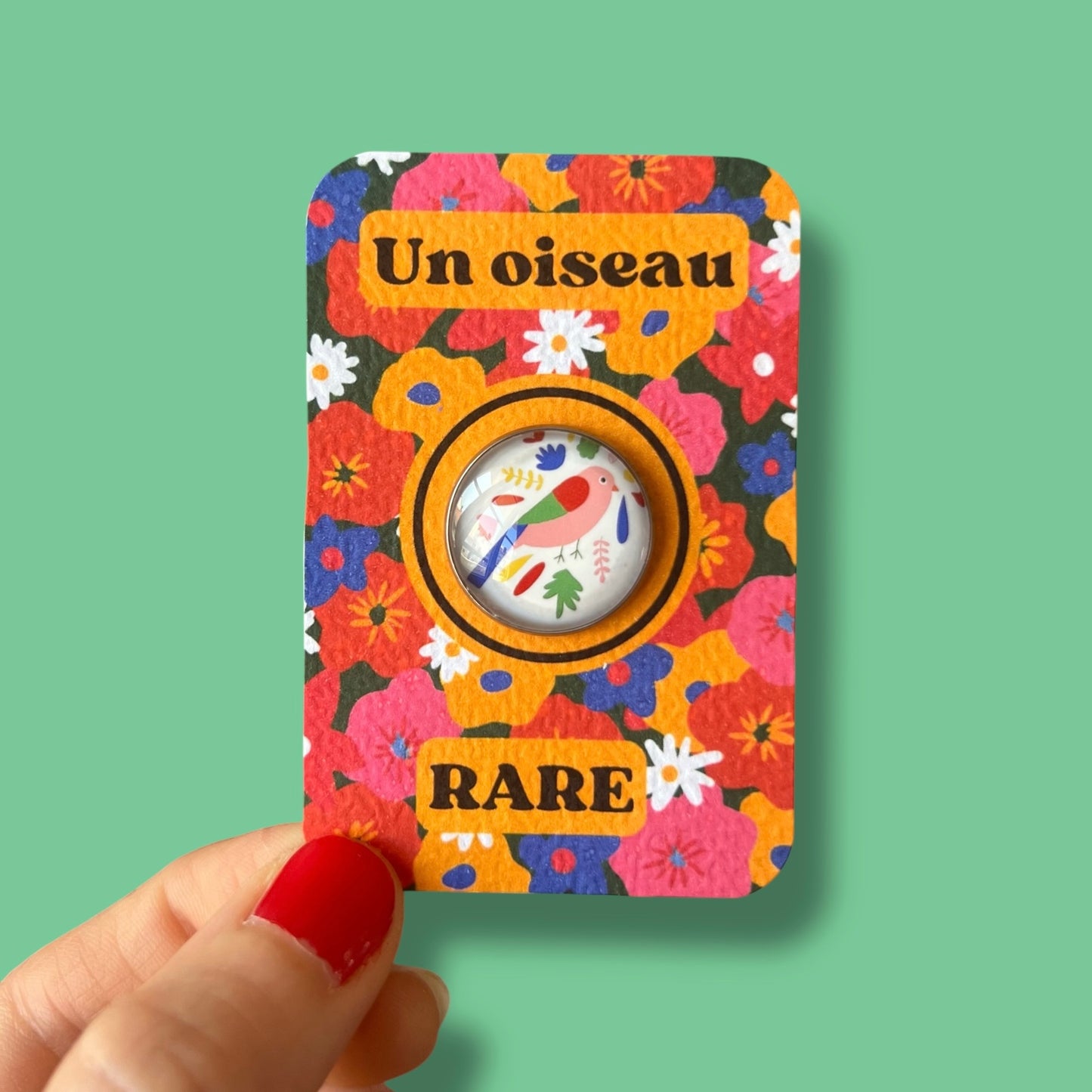 Pin's oiseau multicolore