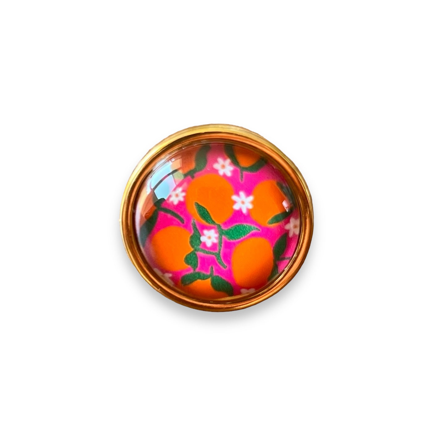 Bague dorée Oranges sur fond rose