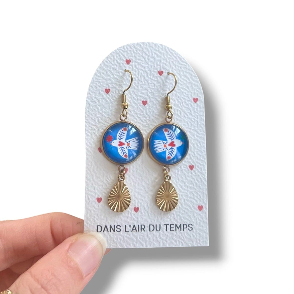 Boucles d'oreilles oiseaux blancs sur fond bleu