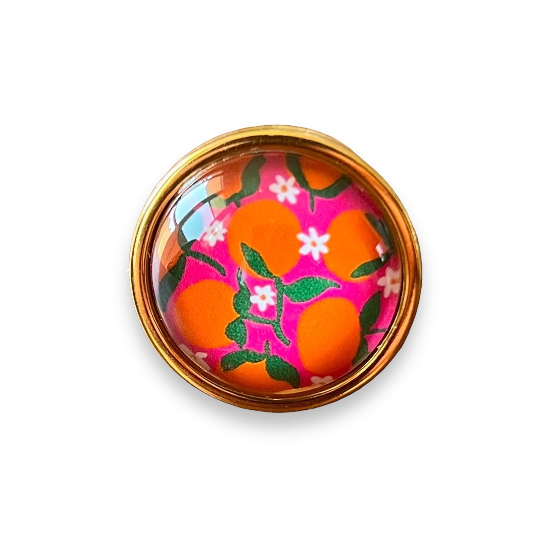 Bague dorée Oranges sur fond rose