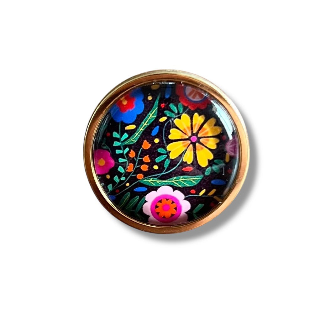 Bague motif floral coloré sur fond noir finition dorée ou argentée