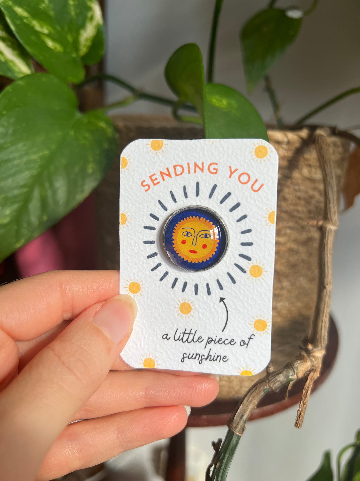 Sun Face pin badge