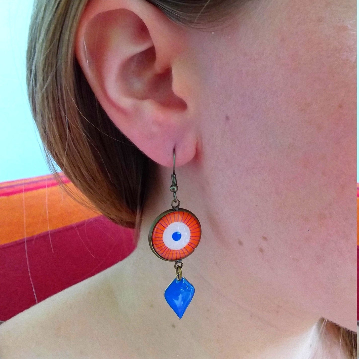 Orange mandala earrings and blue enamel